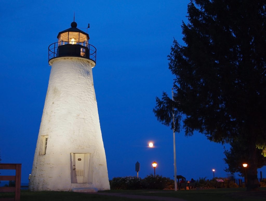 The  Concord Point Lighthouse, in Havre De Grace Maryland, at twilight on a summer evening.